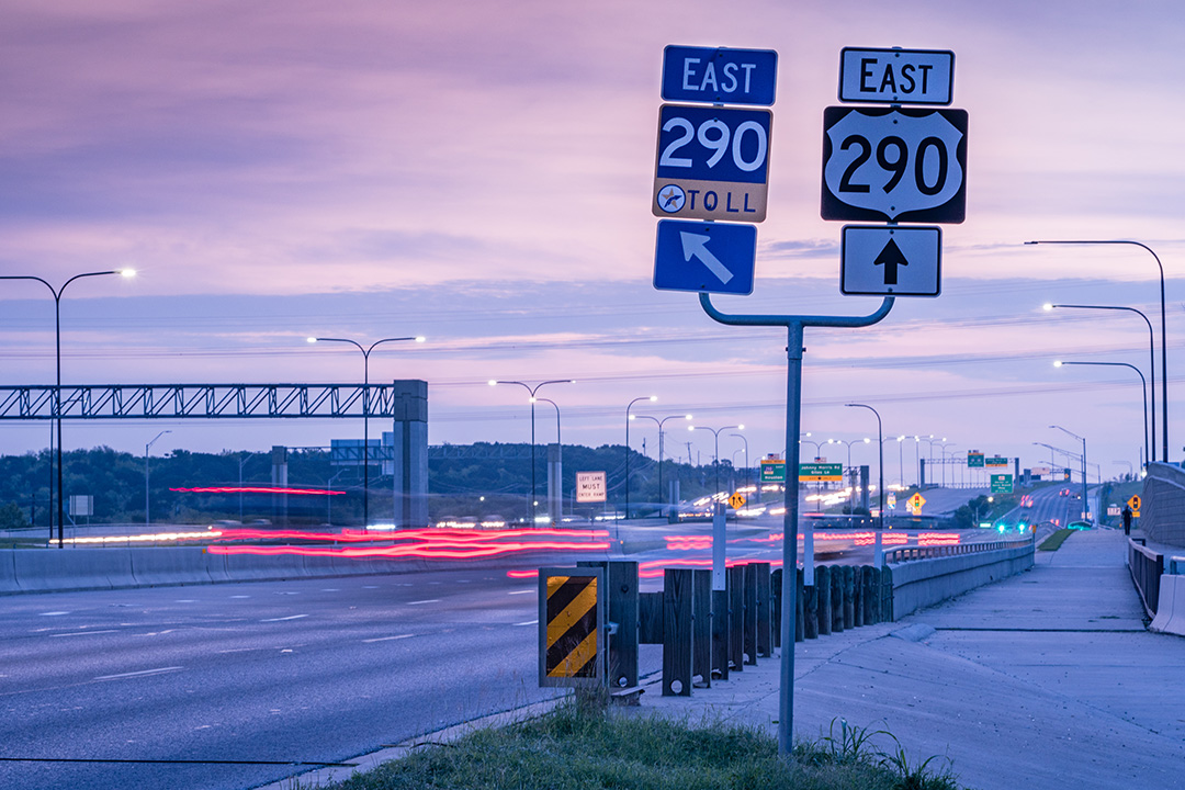 290 Toll signage and road at Dusk